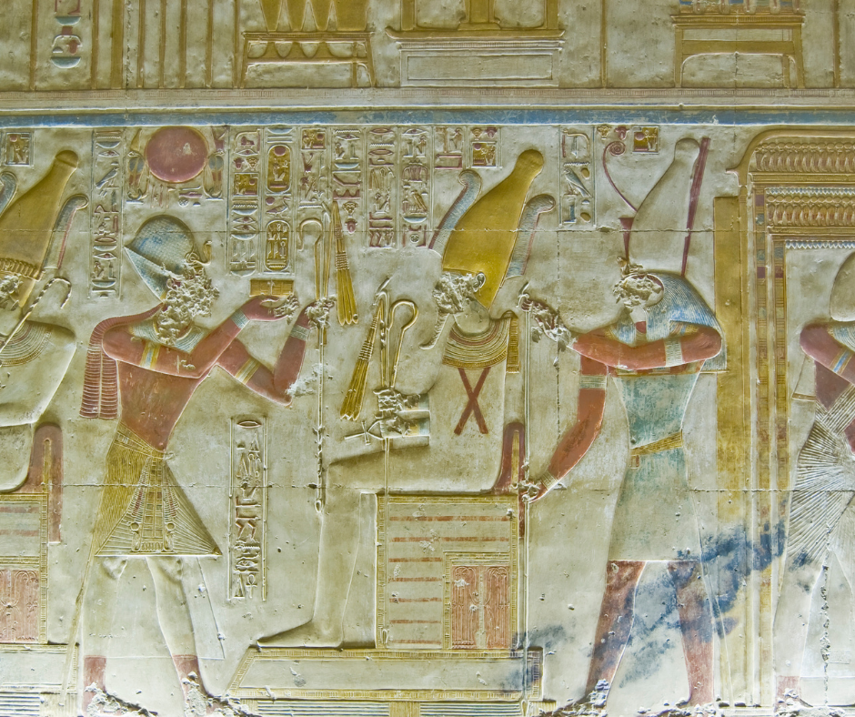 Seti I with Osiris and Horus in his temple in front of the Osirion
